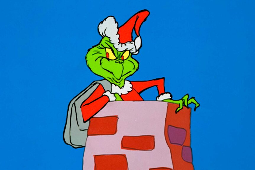 The Grinch, preparing to slide down the chimney